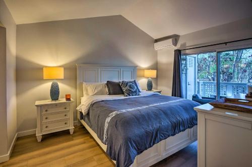 a bedroom with a bed with two lamps and a window at Cozy-Chic Condo Walk to Beach and Park! in Dana Point
