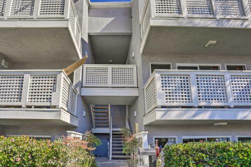 a building with white balconies on the side of it at Cozy-Chic Condo Walk to Beach and Park! in Dana Point