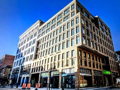 a large white building on a city street at 1406 Sainte Elisabeth in Montreal