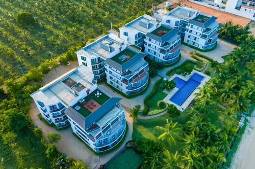 an overhead view of a group of houses on the beach at Beach Paradise Nilaveli in Trincomalee