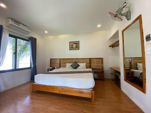 Ένα ή περισσότερα κρεβάτια σε δωμάτιο στο The Legend Coco Beach