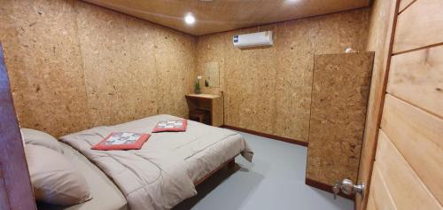 a small room with a small bed in it at Navareeya House Seaview in Ko Lanta