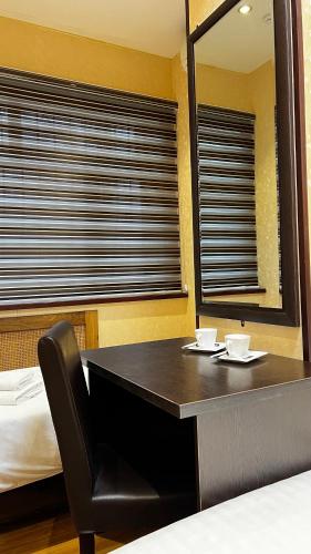 Ένα ή περισσότερα κρεβάτια σε δωμάτιο στο Hayot Hostel