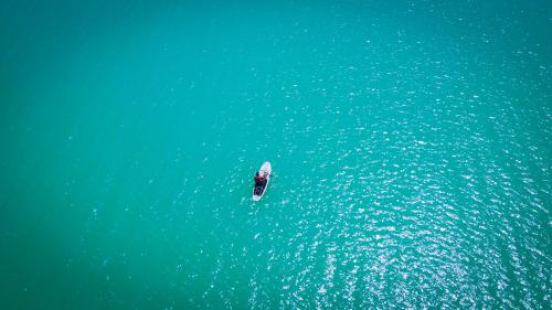 a boat in the middle of the water at Zomay Beachfront Holbox in Holbox Island