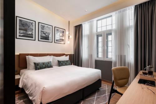 Postel nebo postele na pokoji v ubytování Citadines Connect Georgetown Penang