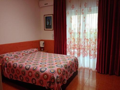 A bed or beds in a room at Villa Betta