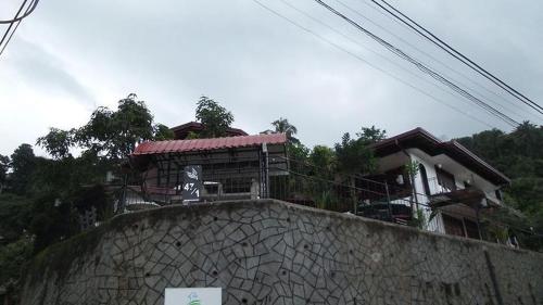 a building on top of a stone wall at New Kandy Residence in Kandy