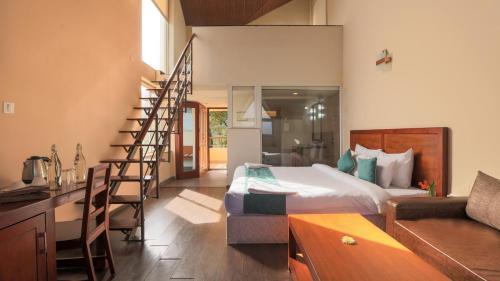 Postel nebo postele na pokoji v ubytování Shola Crown Resort - Munnar