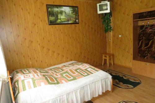 Ένα ή περισσότερα κρεβάτια σε δωμάτιο στο Bilyy Kamin Guest House