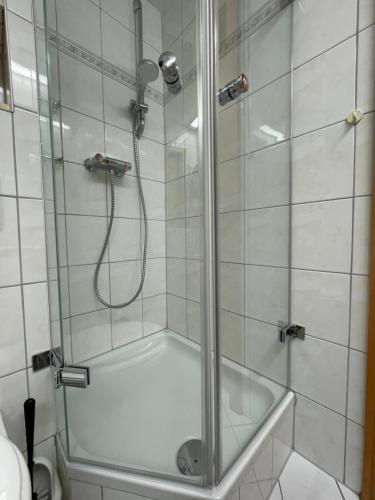 a shower with a glass door in a bathroom at Studio "Auszeit wie dahoam" im Predigtstuhl Resort in Sankt Englmar