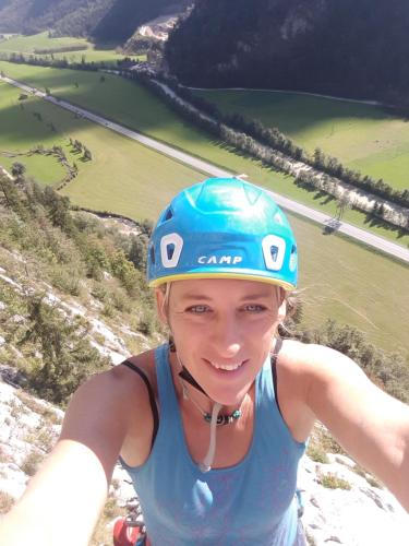 a woman wearing a helmet on top of a mountain at Studio Steinbocks Chill in Kaprun