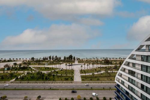 a view of a park next to a building at The Grandeur Hotel in Batumi