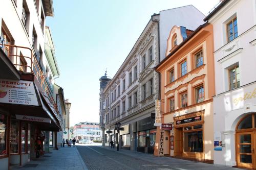 an empty street in a city with buildings at Penzion U Hejtmana in Klatovy