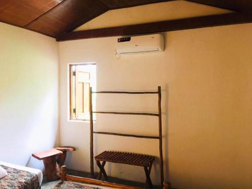 a room with a bunk bed and a bench in it at Eth Mansala in Sigiriya