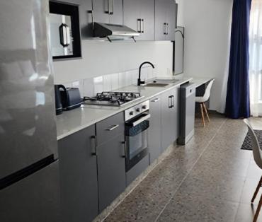 Η κουζίνα ή μικρή κουζίνα στο The Wishing Well Guest House Self-Catering