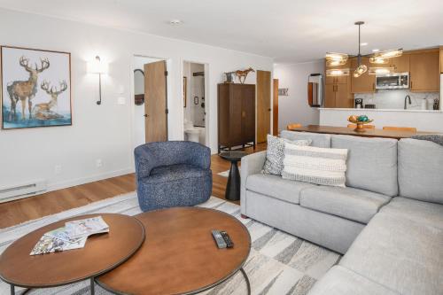 a living room with a couch and a table at Townsend Place B202 Condo in Beaver Creek