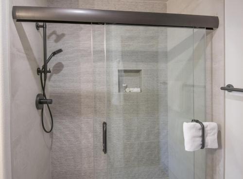 a shower with a glass door in a bathroom at Townsend Place B202 Condo in Beaver Creek