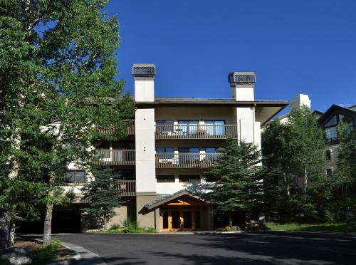 a large building with a balcony on top of it at Townsend Place B202 Condo in Beaver Creek