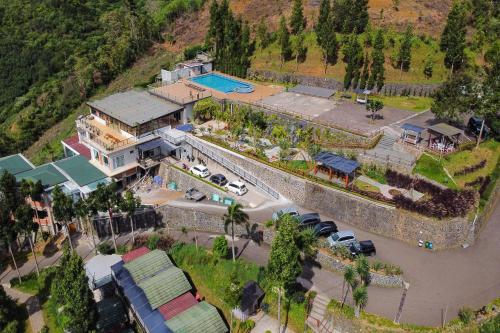 an aerial view of a house with a pool at Alinson Sunset Hill in Bogor