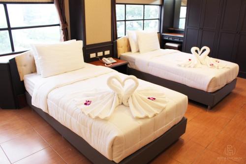 Кровать или кровати в номере Rest@Ratchada hotel