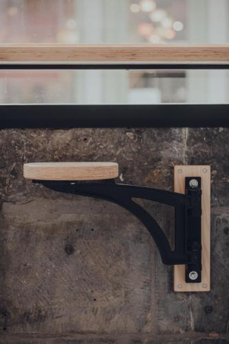 a wooden bench is attached to a window at Cabane Urbaine 2 - centre in Namur