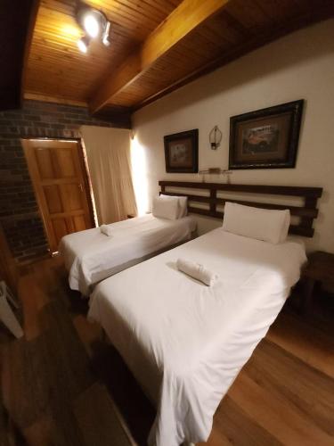 Ένα ή περισσότερα κρεβάτια σε δωμάτιο στο Rusplek Guesthouse and Conference Centre