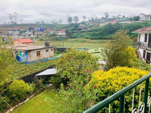 a view of a city from a balcony at Sinora Holiday Bungalow in Nuwara Eliya