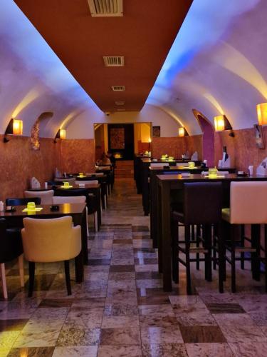 En restaurant eller et andet spisested på Fantastico Exlcusive Hotel