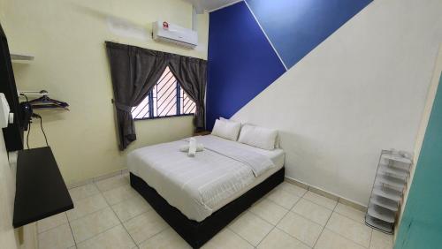 Ліжко або ліжка в номері Guest House at Johor Bahru