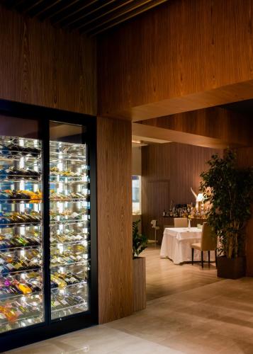 a room with a large display of wine glasses at Hotel Commercio in Battipaglia