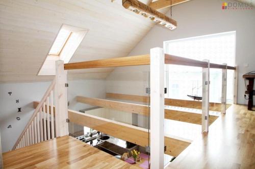 a staircase in a house with wooden floors at Veski Villa in Pärnu