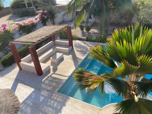 Πισίνα στο ή κοντά στο Villa avec piscine entre plage et Siné Saloum