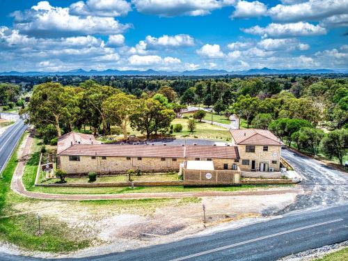 an aerial view of an old house on the side of a road at Kandos Fairways Motel in Kandos