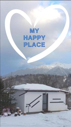 a white garage with a heart in the sky at Touch the Sky in Moieciu de Jos