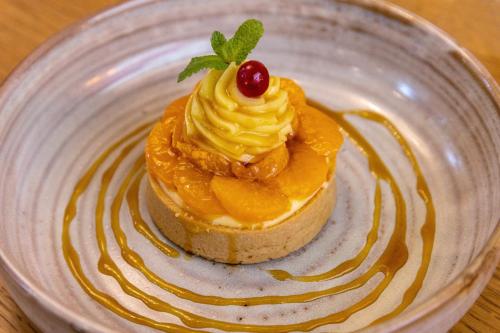 a dessert on a plate on a table at Aiden by Best Western Paris Roissy CDG in Roissy-en-France