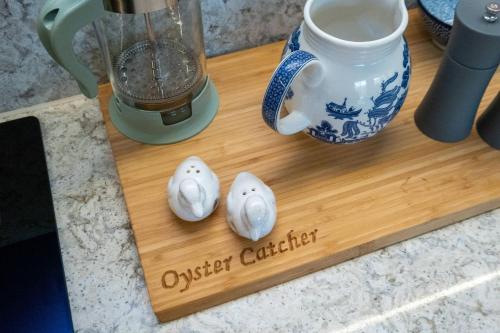 a wooden cutting board with a blender on a counter at Alde Bay Farm - Oyster Catcher in Aldeburgh