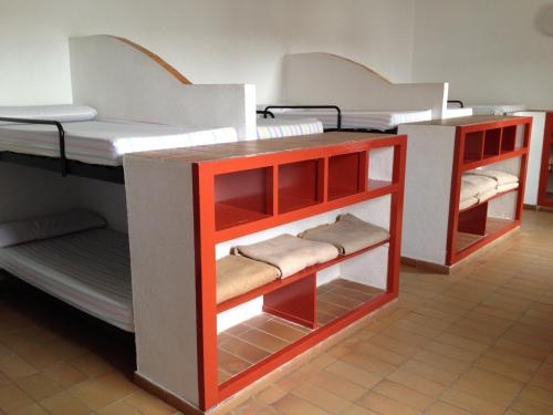 two bunk beds are in a room with at Alberg L'Escala Xanascat in L'Escala