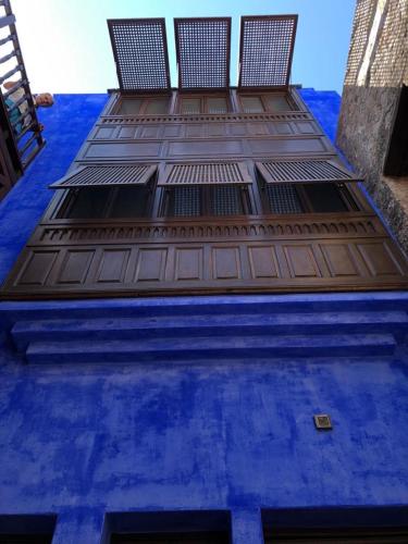 a tall blue building with the top of it at Casa Muse Kastellorizo Whole House in Meyisti