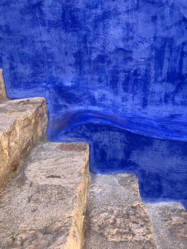 a painting of a pool of blue water at Casa Muse Kastellorizo Whole House in Meyisti