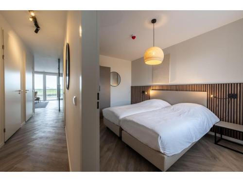 Postel nebo postele na pokoji v ubytování Loft Apartment by Veerse Meer Marina