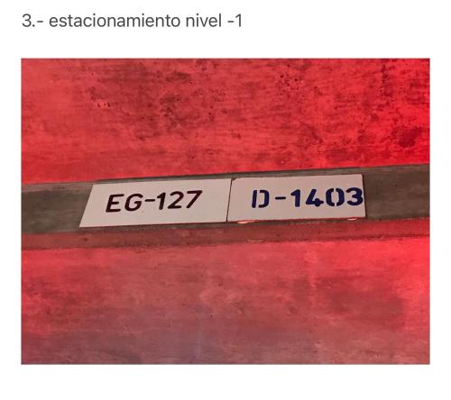 a sign on the side of a red wall at Condominio San Alfonso Del Mar - Vista Inmejorable in Algarrobo