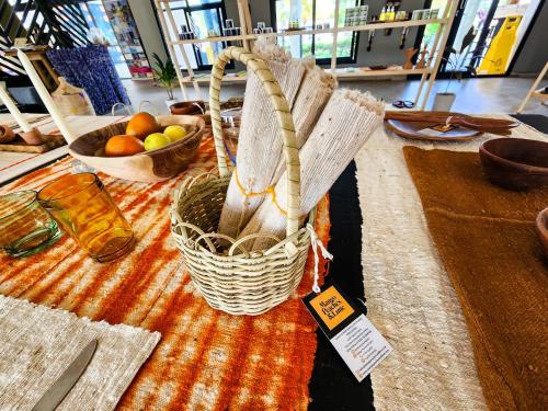 a table with baskets of fruit on a table at Tamala Beach Resort in Kotu
