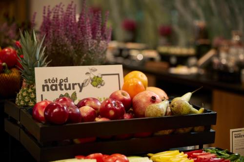 a display of apples and pears on display in a store at Q Hotel Plus Wrocław Bielany in Wrocław