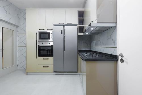 Η κουζίνα ή μικρή κουζίνα στο BKT Cribs - Apartments & Suites