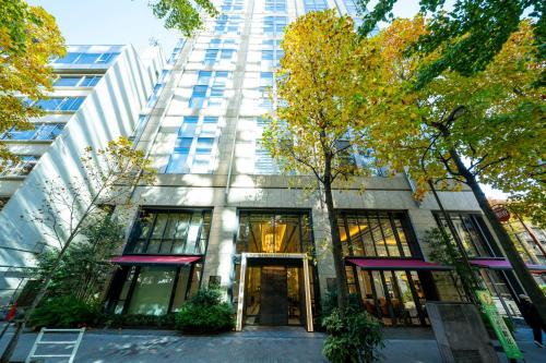 a tall building with a door in front of it at KOKO HOTEL Premier Nihonbashi Hamacho in Tokyo