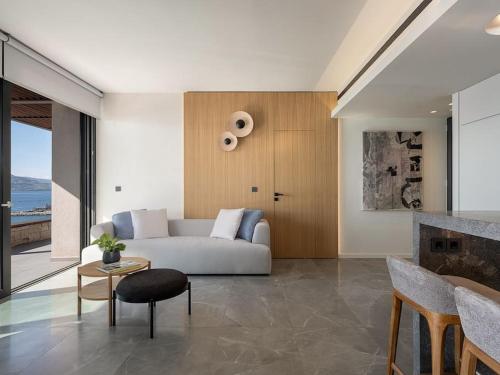 a living room with a couch and a fireplace at Vicky's Island View in Marathi