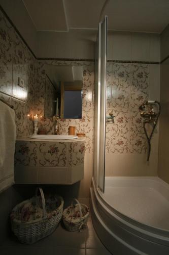 a bathroom with a shower and a sink and a tub at Apartmány ReMi Vysoké Tatry in Starý Smokovec