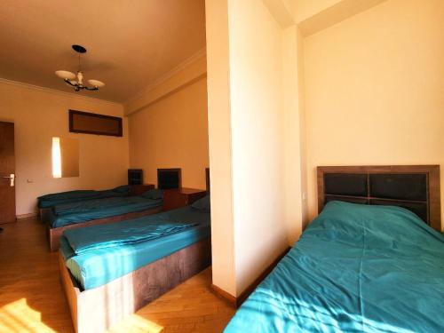 a room with two beds in a room at ArevaHostel&Apartment in Yerevan