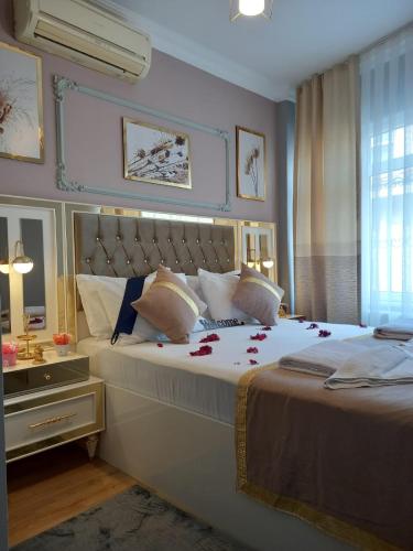 Katil atau katil-katil dalam bilik di Emirhan Guesthouse & Suites