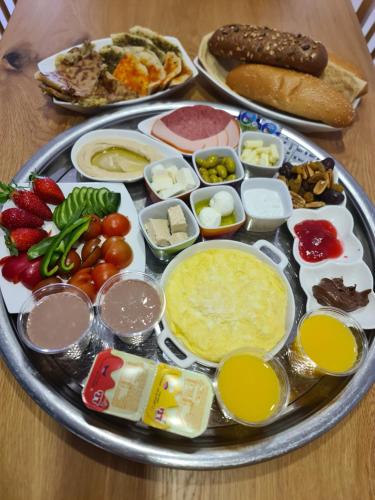 a tray of food with different foods on a table at סוויטת נור Noor Suite in Majdal Shams